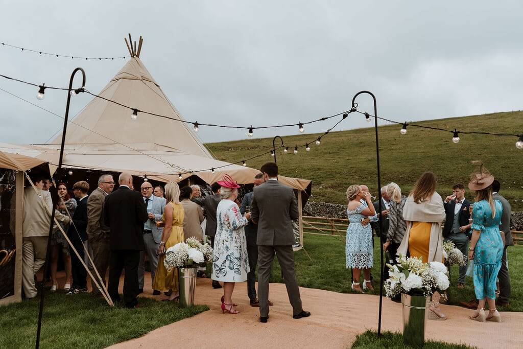 Wedding Guests Outside A Tipi