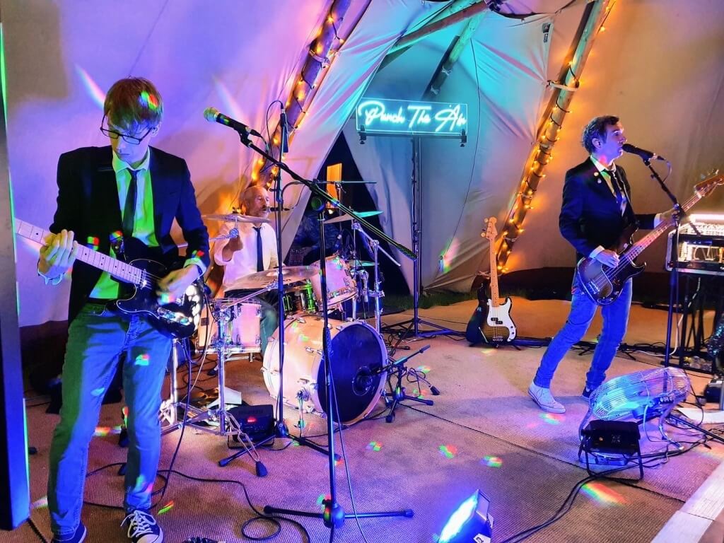 Punch The Air Wedding Band Playing In A Tipi